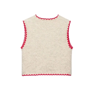 Minimalist knit vest with red embroidered scalloped edges, cream white back view