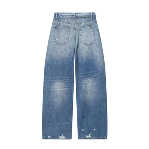 Vintage light blue high waisted wide leg jeans with distressed back pocket details