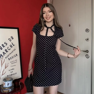 French retro style black polka dot mini dress with square neck and bow tie detail