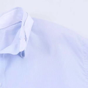 Detail of blue striped shirt with white contrast collar and fine vertical fabric texture