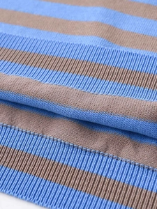 Detailed macro view of the blue and brown striped knit fabric with ribbed texture
