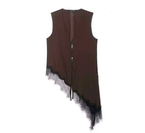 Detail of dark brown tank top featuring asymmetric hem with black eyelash lace trim