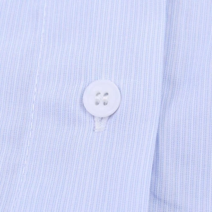 Close-up of light blue and white pinstriped fabric with high-quality white button detail