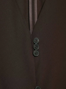 Close-up of brown V-neck vest with textured twill fabric and matte black buttons