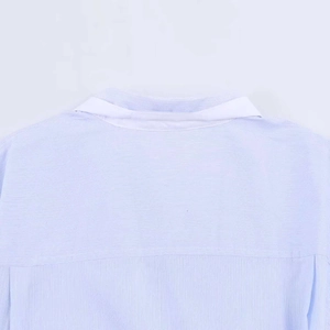 Detailed view of back yoke and stitching on blue striped cotton commuter shirt