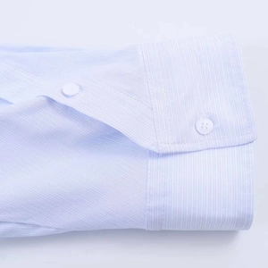 Close-up of blue striped shirt cuff with neat stitching and two white buttons