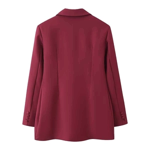 Detail view of the back of a slim fit burgundy blazer with waist darts and buttoned cuffs