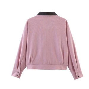 Detailed back view of a pink corduroy jacket with contrast black faux leather collar