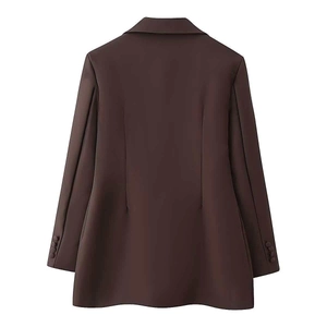 Detail view of the tailored back profile and buttoned cuffs of a brown blazer jacket