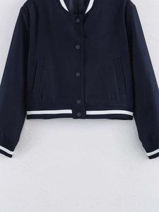Detail of dark blue cropped bomber jacket with white striped ribbed collar and cuffs