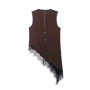Minimalist brown vest with deep V-neck and asymmetrical black lace hem in a flat lay view