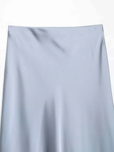 Detail shot of light blue satin midi skirt showing smooth waistband and glossy fabric texture