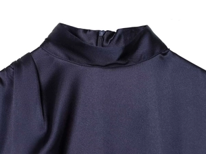 Detail of navy satin mini dress featuring high neckline and back zipper closure
