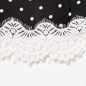 Polka dot skirt with white eyelash lace trim detail and delicate floral pattern