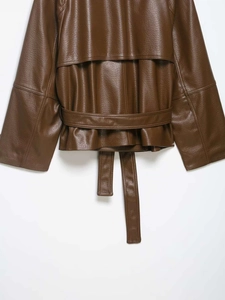 Detail view of the deep brown leather jacket storm flap with textured PU finish and belt
