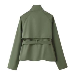 Detail view of olive green short trench coat back with storm flap and belted waist