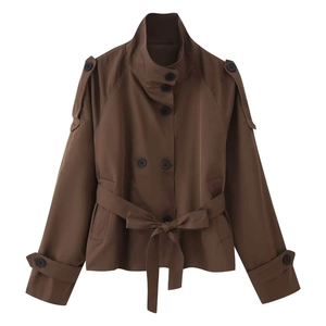 Short double-breasted brown trench jacket with belted waist and epaulets on white backdrop