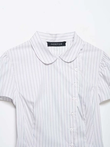 Close-up of striped poplin shirt with Peter Pan collar and asymmetric button closure