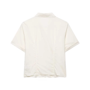 Minimalist off-white poplin short sleeve shirt with back stitching detail on plain white background