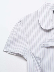 Detailed view of the Peter Pan collar and blue striped poplin fabric on short sleeve shirt