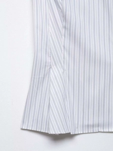 Detail of blue and white striped poplin shirt showing fine hem stitching and fabric texture