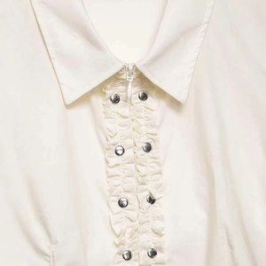 White poplin shirt for women featuring a zip-up front with layered ruffled rivet details