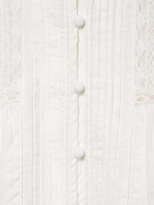 Detail of ivory lace shirt with fabric buttons and vertical pleats in cotton blend