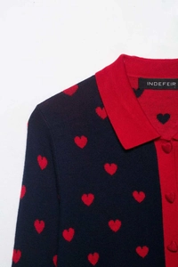 Close-up of heart jacquard knit cardigan with contrast polo collar and heart buttons