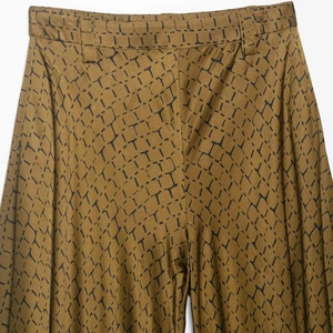 Women's high waist wide leg trousers with snake print pattern and smooth drape finish