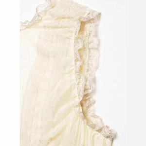 Women's summer V-neck sleeveless blouse with layered ruffles and lace details in beige