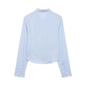 Slim fit light blue long sleeve shirt for women featuring a curved hem back view