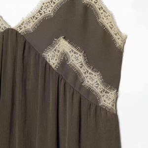 Olive green V-neck camisole dress with delicate beige eyelash lace trim and pleated texture