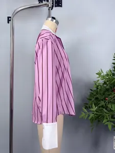Detail of pink and purple striped shirt featuring contrast white collar and cuffs design