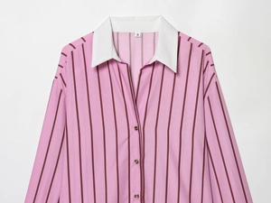 Detail of pink striped shirt featuring a white contrast collar and dark metallic buttons