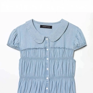 Light blue short sleeve shirt with Peter Pan collar and ruffled details in retro style
