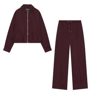 Women's burgundy knit leisure set with a zip-up jacket and wide-leg trousers