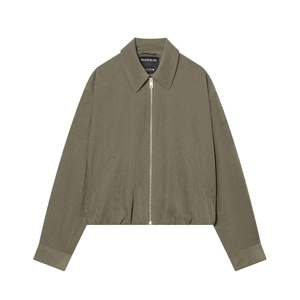 Close-up detail of dark olive green zip-up jacket with silver metal zipper and lapel collar