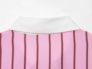 Detailed close-up of white collar and pink vertical stripe pattern on loose shirt