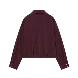 Rear view of deep burgundy zip-up jacket featuring elastic hem and gold cuff buttons