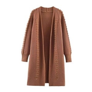 Women's long caramel knit cardigan with pearl embellishments and ribbed cuffs on white