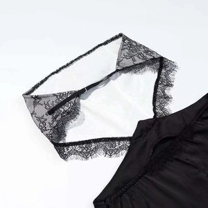 Sleek black satin slip dress featuring elegant eyelash lace trim and thin straps