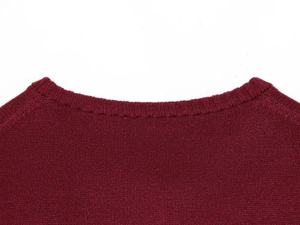 Detailed view of the ribbed crew neck and fine knit texture of a burgundy cardigan