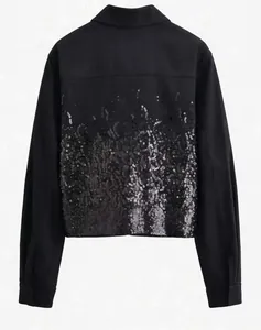 Detail of a black jacket with gradient silver sequins and high-quality twill fabric texture
