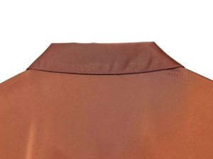 Detailed view of the smooth satin texture and neat neckline stitching on this brown shirt