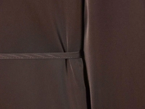 Detailed macro view showing the dark brown satin fabric texture and precise stitching detail