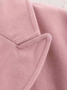 Detailed macro view of the pink wool coat collar showing stitching and soft fabric texture