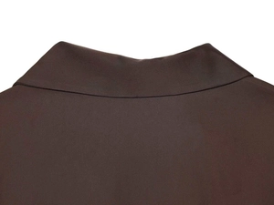 Detailed close-up of dark brown satin shirt neckline showing precise stitching and fabric