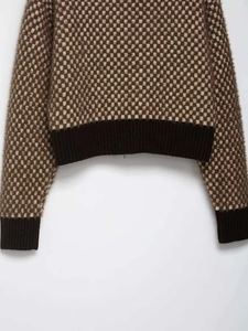 Detail of vintage brown checkerboard knit sweater with textured mohair feel and ribbed cuff