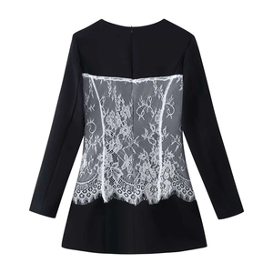 Elegant black long sleeve dress featuring intricate white floral lace back and eyelash trim
