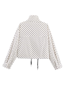 Close-up of women's polka dot jacket back with stand collar and adjustable drawstring hem
